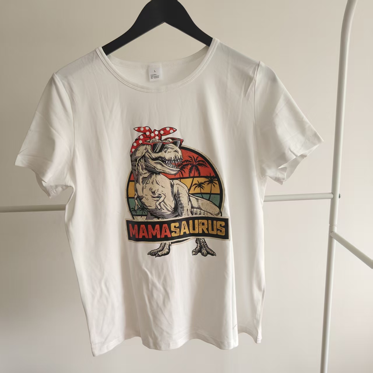 9519bc9a7393fc20d2fe072789f4c339 Women’s Mamasaurus T-Shirt, Retro Dinosaur Mom Tee, Funny Mother’s Day Gift, White - Image 1